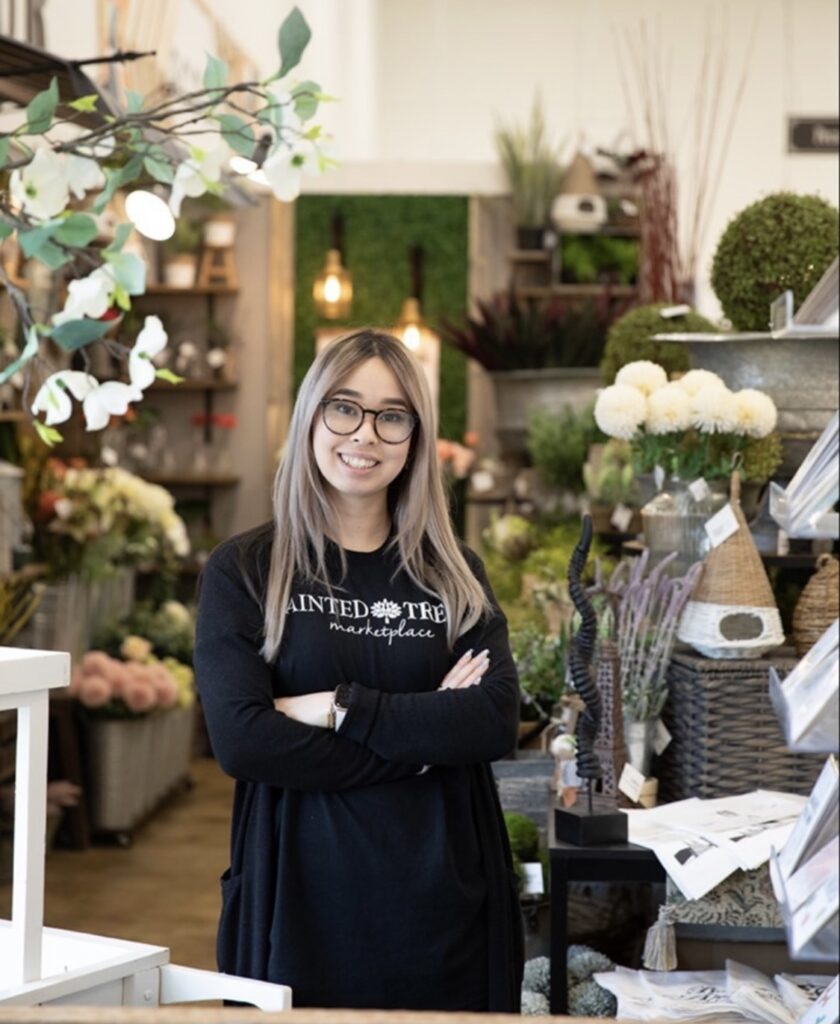 smiling woman wearing Painted Tree shirt